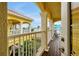 Inviting balcony with white railings and columns, showcasing the beautiful community views at 2982 S Atlantic Ave, New Smyrna Beach, FL 32169