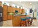 Bright kitchen with stainless steel appliances, granite counters, and eat-in island at 2982 S Atlantic Ave, New Smyrna Beach, FL 32169