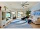 Bright living room with tile floors, large windows, comfortable seating and stylish decor at 2982 S Atlantic Ave, New Smyrna Beach, FL 32169