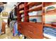 Walk-in closet featuring custom wood shelving and drawers for maximum storage at 2982 S Atlantic Ave, New Smyrna Beach, FL 32169