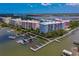 Colorful waterfront condos featuring private docks and boat slips with stunning views of the intercoastal waterway at 3 Riverwalk Dr # 404, New Smyrna Beach, FL 32169