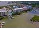 Aerial view featuring building exteriors and waterfront views at 3 Riverwalk Dr # 404, New Smyrna Beach, FL 32169