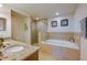 Beautiful bathroom with a walk-in shower and tub at 3 Riverwalk Dr # 404, New Smyrna Beach, FL 32169