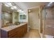 Dual sink bathroom featuring a walk-in shower at 3 Riverwalk Dr # 404, New Smyrna Beach, FL 32169