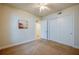 Neutral bedroom featuring carpet floors, a ceiling fan, and closet at 3 Riverwalk Dr # 404, New Smyrna Beach, FL 32169