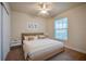 Bedroom featuring a large bed and window at 3 Riverwalk Dr # 404, New Smyrna Beach, FL 32169