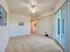 Bright bedroom featuring a ceiling fan and balcony access at 3 Riverwalk Dr # 404, New Smyrna Beach, FL 32169