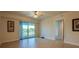 Bright bedroom featuring large windows, ample natural light, and a sliding door leading to a balcony at 3 Riverwalk Dr # 404, New Smyrna Beach, FL 32169