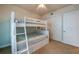 Bedroom featuring bunk beds and closet at 3 Riverwalk Dr # 404, New Smyrna Beach, FL 32169