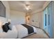 Bright bedroom featuring a ceiling fan, ensuite, and balcony access at 3 Riverwalk Dr # 404, New Smyrna Beach, FL 32169