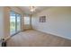 Spacious bedroom with a ceiling fan and balcony at 3 Riverwalk Dr # 404, New Smyrna Beach, FL 32169