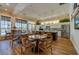 The clubhouse kitchen offers stainless appliances, granite counters, and an island with seating for a delightful gathering at 3 Riverwalk Dr # 404, New Smyrna Beach, FL 32169