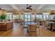 Spacious clubhouse offers ample seating, wood-look flooring, and views of the pool area and beautiful outdoor scenery at 3 Riverwalk Dr # 404, New Smyrna Beach, FL 32169