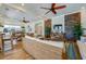 Enjoy the clubhouse's comfortable seating, stone accent wall, and open kitchen area for social gatherings and entertainment at 3 Riverwalk Dr # 404, New Smyrna Beach, FL 32169