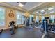 Well-equipped gym with mirrored walls, weight machines, free weights, stationary bike, and fitness ball at 3 Riverwalk Dr # 404, New Smyrna Beach, FL 32169