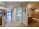 Open-concept interior featuring tile flooring, bathroom, washer and dryer with plenty of storage space at 3 Riverwalk Dr # 404, New Smyrna Beach, FL 32169