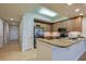 Well-equipped kitchen featuring granite countertops, stainless steel appliances, and stylish cabinetry at 3 Riverwalk Dr # 404, New Smyrna Beach, FL 32169