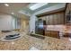 Modern kitchen featuring granite countertops, stainless steel appliances, and sleek, wooden cabinetry at 3 Riverwalk Dr # 404, New Smyrna Beach, FL 32169