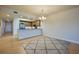 Bright kitchen with stainless steel appliances and bar seating overlooking an open living space at 3 Riverwalk Dr # 404, New Smyrna Beach, FL 32169