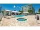 Enjoy the community pool area with hot tub, covered seating, and well-maintained landscaping perfect for relaxation at 3 Riverwalk Dr # 404, New Smyrna Beach, FL 32169