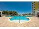Enjoy the pool area with its freeform pool, lush landscaping, and comfortable seating for a perfect outdoor experience at 3 Riverwalk Dr # 404, New Smyrna Beach, FL 32169