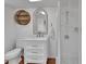 Stylish bathroom features a new vanity, decorative mirror, and walk-in shower at 310 Main St, Enterprise, FL 32725