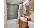 Charming bathroom boasts a vintage vanity with a vessel sink and tiled shower at 310 Main St, Enterprise, FL 32725