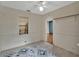 Bright bedroom with hardwood floors and a view into the custom kitchen at 310 Main St, Enterprise, FL 32725