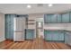 Well-designed kitchen with modern cabinets, stainless steel appliances, and ample counter space at 310 Main St, Enterprise, FL 32725