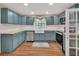 Stylish kitchen featuring custom cabinets, butcher block countertops, and modern appliances at 310 Main St, Enterprise, FL 32725