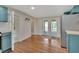 Open kitchen and dining area with modern cabinets and stainless steel refrigerator at 310 Main St, Enterprise, FL 32725