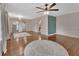 Bright living room showcasing hardwood floors, a decorative accent wall, and ample natural light at 310 Main St, Enterprise, FL 32725
