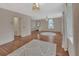 Inviting living room with hardwood floors, large windows, and elegant curtains at 310 Main St, Enterprise, FL 32725