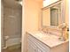 Well-lit bathroom features a shower-tub combo, and a white vanity with a light-colored countertop at 3131 S Ridgewood Ave # 4120, Daytona Beach, FL 32119