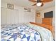 Serene bedroom featuring a patchwork quilt bed and bright natural light from the window at 3131 S Ridgewood Ave # 4120, Daytona Beach, FL 32119