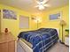 Bright bedroom featuring a full-size bed, colorful walls, and a view of the window at 3131 S Ridgewood Ave # 4120, Daytona Beach, FL 32119