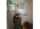 Functional laundry room with washer, dryer, and ample storage space at 328 W Connecticut Ave, Lake Helen, FL 32744