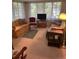 Bright living room with comfortable seating and lots of natural light at 328 W Connecticut Ave, Lake Helen, FL 32744