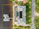 Aerial view of large home featuring a waterfront pool and boat dock at 3310 John Anderson Dr, Ormond Beach, FL 32176