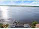 Aerial view of waterfront property with a private boat dock at sunset at 3310 John Anderson Dr, Ormond Beach, FL 32176