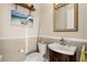 Cozy powder room features a modern sink, toilet, and stylish decor at 3310 John Anderson Dr, Ormond Beach, FL 32176