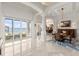 Elegant dining room with water views and sliding glass doors to outdoor living area at 3310 John Anderson Dr, Ormond Beach, FL 32176
