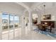 Bright dining room features marble floors, water views, and waterfront access at 3310 John Anderson Dr, Ormond Beach, FL 32176
