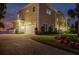 Elegant home featuring a brick driveway, well-manicured lawn, and an attached garage at 3310 John Anderson Dr, Ormond Beach, FL 32176