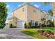 Beautifully landscaped home with a brick driveway and attached garage at 3310 John Anderson Dr, Ormond Beach, FL 32176