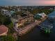 Aerial view of rear of home showcases private pool and dock on the water at 3310 John Anderson Dr, Ormond Beach, FL 32176