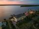 Aerial view features waterfront home with private dock, and well-maintained landscaping at 3310 John Anderson Dr, Ormond Beach, FL 32176