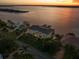 Stunning waterfront home with lush landscaping, private docks, and breathtaking sunset views at 3310 John Anderson Dr, Ormond Beach, FL 32176