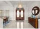 Bright foyer with marble flooring and view of the formal dining room at 3310 John Anderson Dr, Ormond Beach, FL 32176