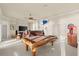 Game room features a pool table, lounge seating, a marlin, and an arcade game at 3310 John Anderson Dr, Ormond Beach, FL 32176